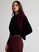 Black cashmere lace trim cardigan styled with burgundy trousers